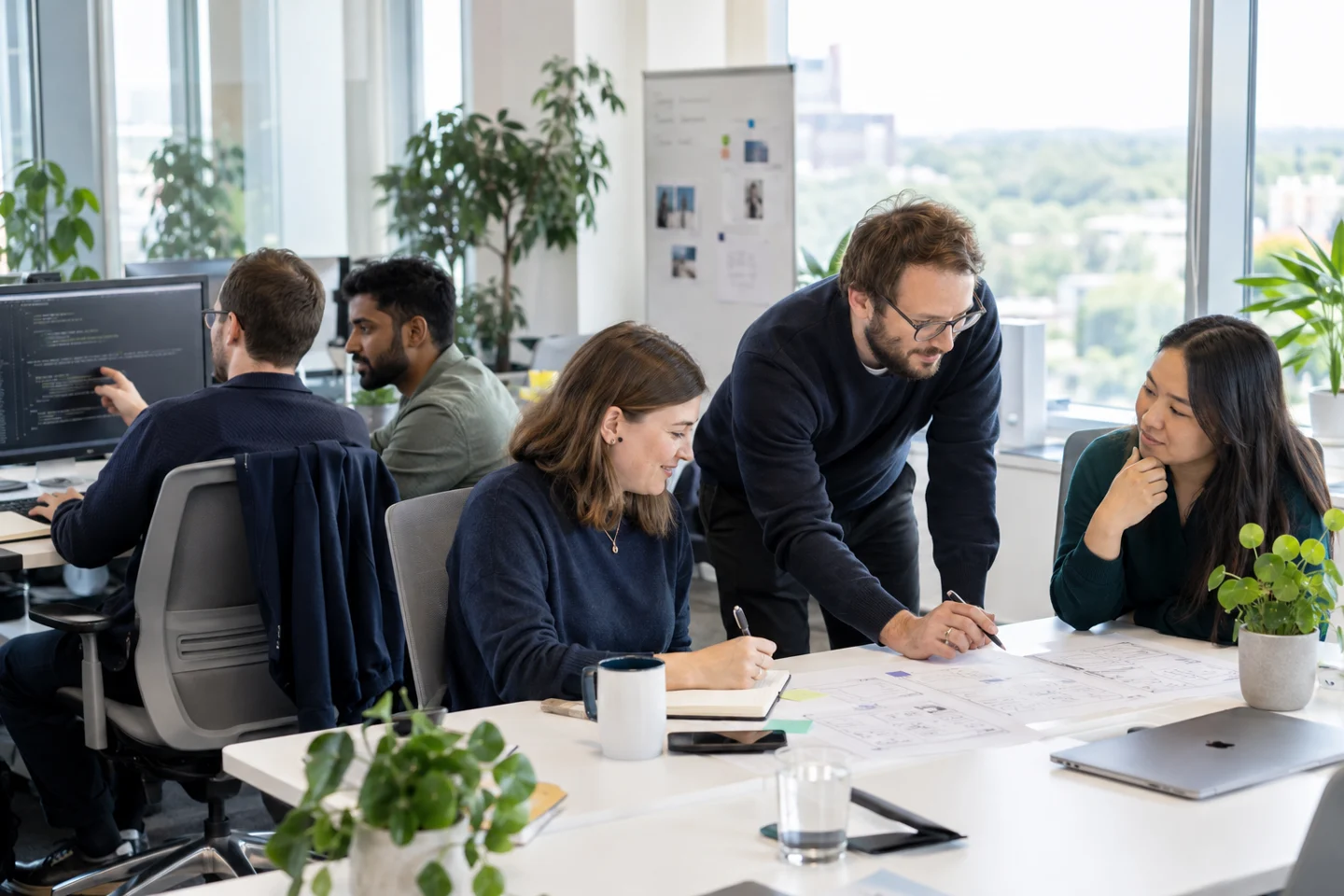 Software colleagues collaborating across development and design work — AI-generated illustration